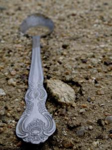 A spoon in the dirt