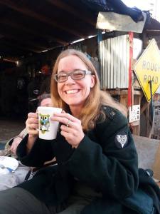 A blonde woman with a cup of tea