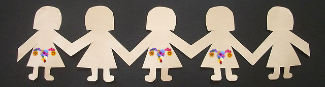 paper dolls holding hands