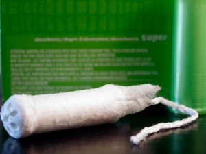 An unwrapped, unused tampon