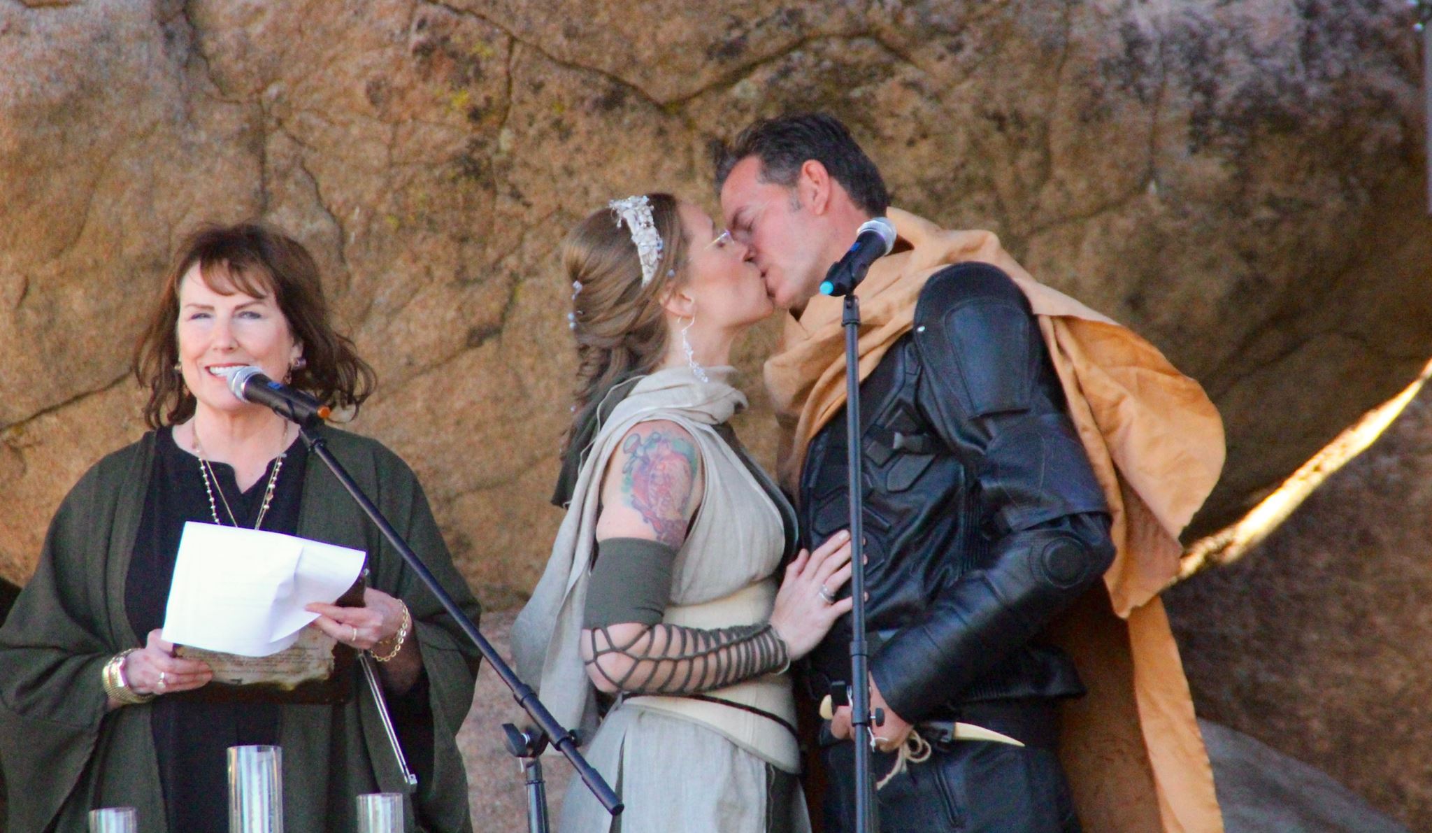 Bride and groom kissing at wedding