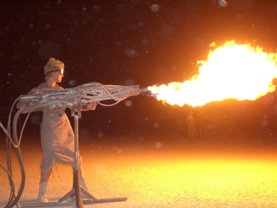 Girl with flame thrower at Burning Man