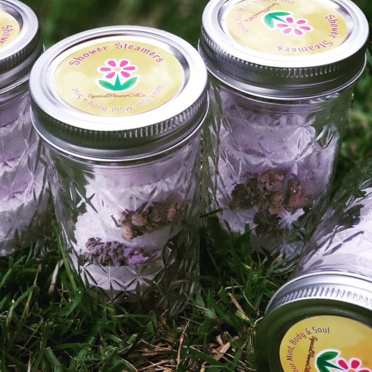 Mason jar filled with shower steamers by Special Flower Oil, Co,