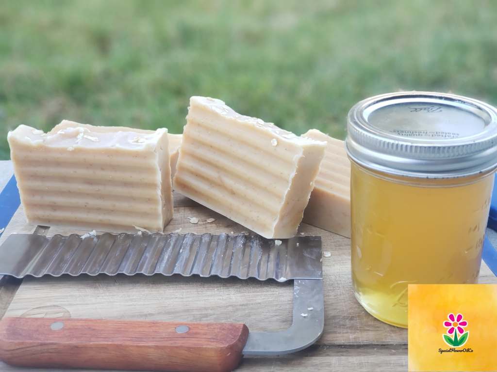 Jar of raw honey and freshly cut handmade soap by Special Flwoer Oil, Co.