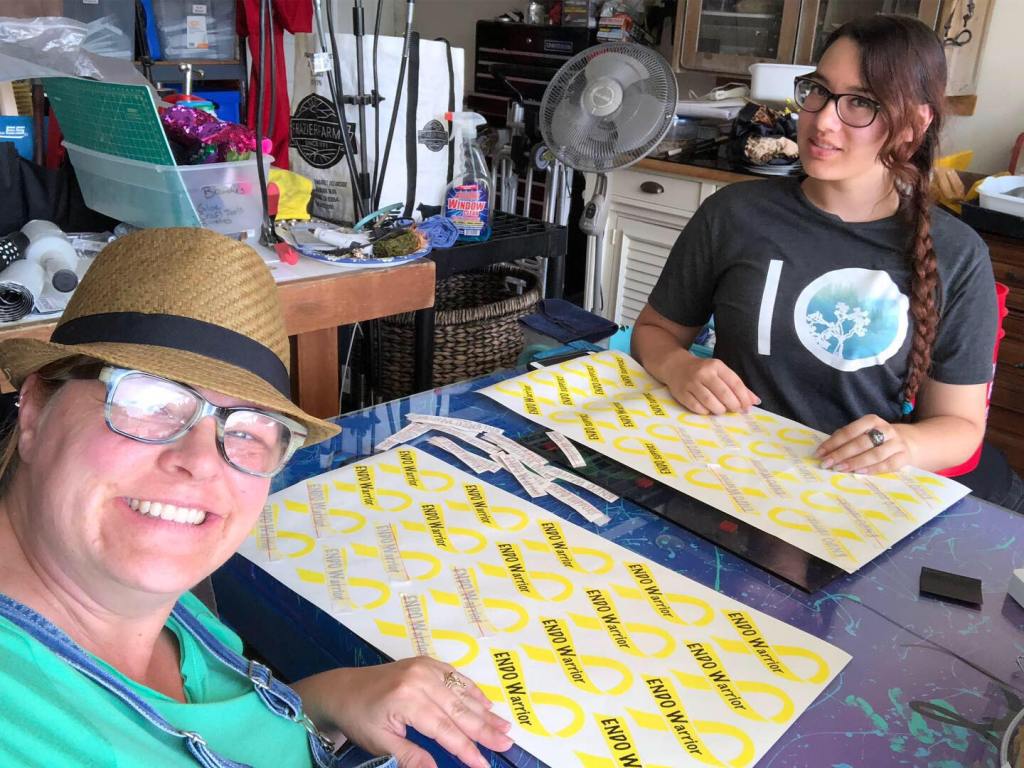 Brandy and Sam manufacturing the yellow ribbon EndoWarrior and EndoSupoprt decals