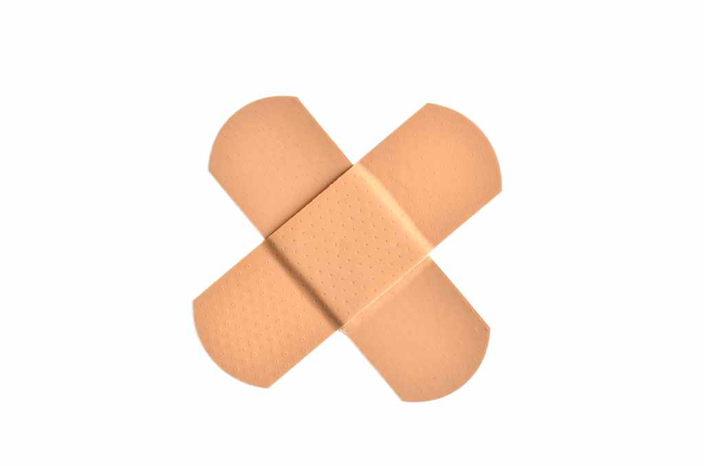 Bandaids crossing into an X
