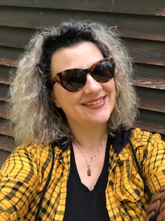 Woman in yellow shirt and sunglasses